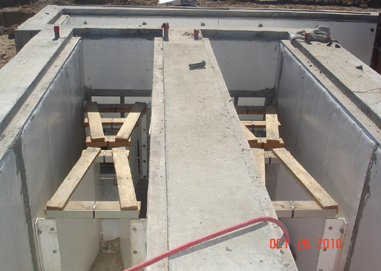 Two small sized FRP Parshall flumes being installed in concrete channels