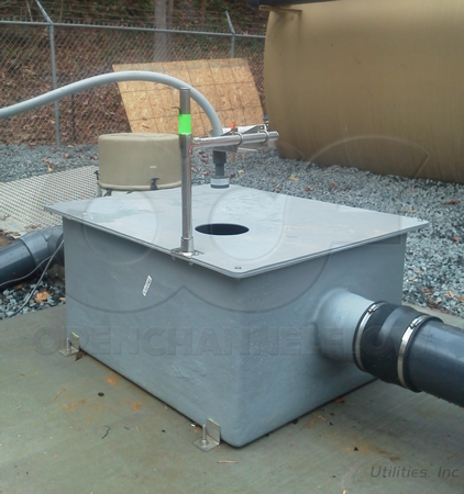 ultrasonic mounting bracket over a fiberglass weir box measuring treated WWTP effluent