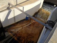 Fiberglass Parshall flume installed in a concrete channel