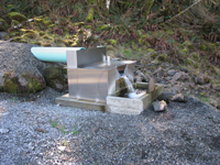 pipe flow spilling into an Openchannelflow stainless steel weir box measuring dam seepage
